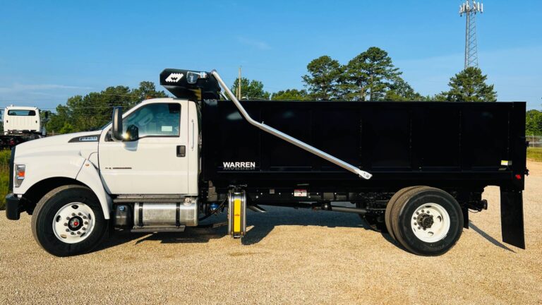 Warren contractor dump body with 42-inch sides and raised UMB hoist on a white Ford F-750